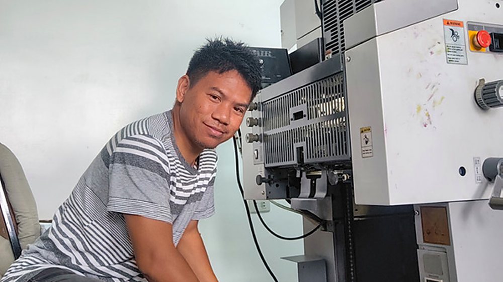 ICP Philippines project director Florence Paguio running Character Code for Life Module 3 on the press.